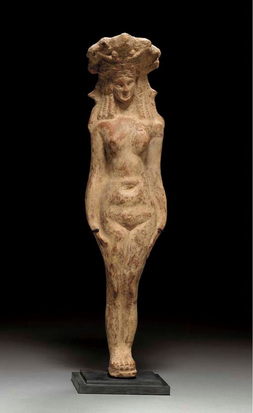 AN EGYPTIAN TERRACOTTA FIGURE OF HATHOR