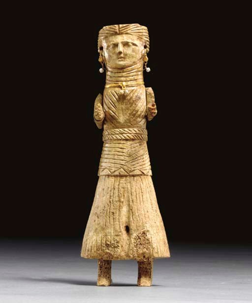 A COPTIC BONE FEMALE FIGURE WITH GOLD ATTRIBUTES