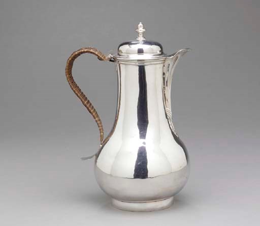 A GEORGE III SILVER HOT WATER JUG,