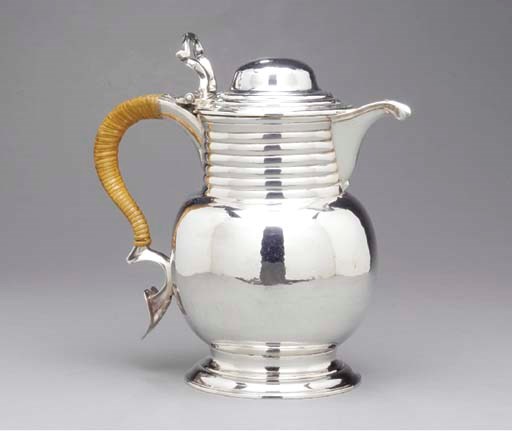A GEORGE III SILVER HOT WATER JUG,