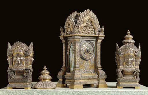 A FRENCH BRASS ENAMELED AND WHITE METAL CLOCK GARNITURE,