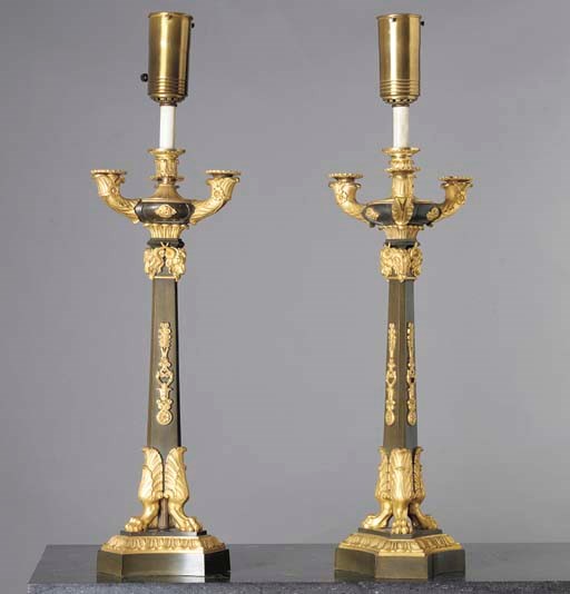 A PAIR OF LOUIS-PHILIPPE ORMOLU AND PATINATED BRONZE FOUR-LIGHT CANDELABRA NOW MOUNTED AS LAMPS,