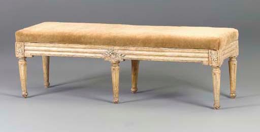A CONTINENTAL CREAM-PAINTED BENCH,