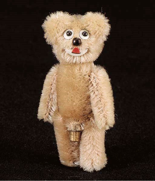 A Schuco Janus, two-face miniature teddy bear