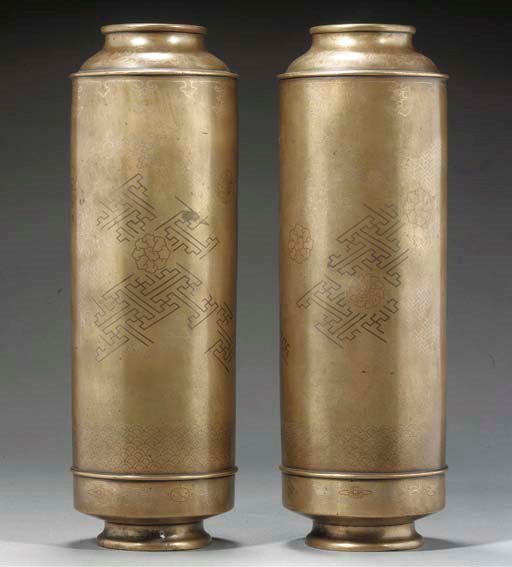 A pair of polished bronze vases
19th Century