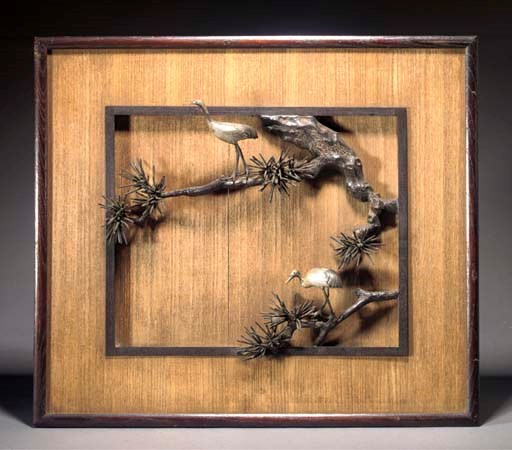 A Japanese wood panel with bronze relief of crane on pine
Early 20th century