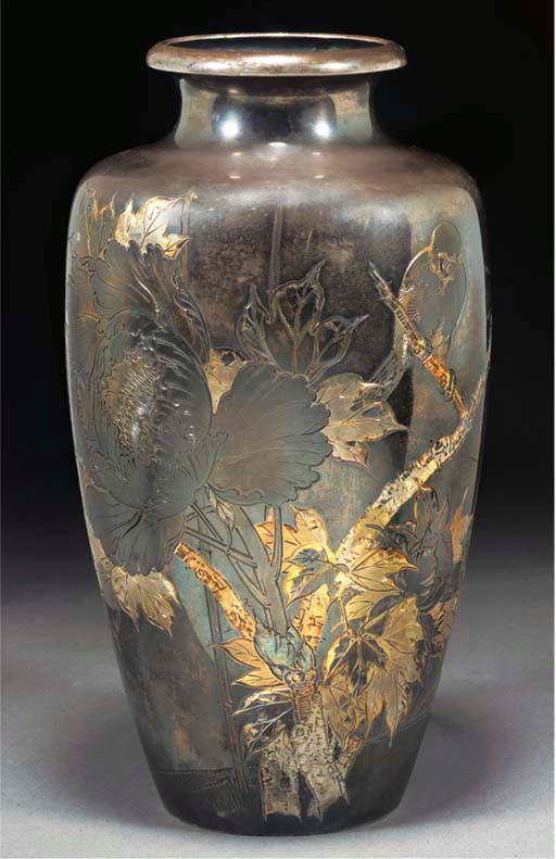 A silver and gilt inlaid vase
early 20th century