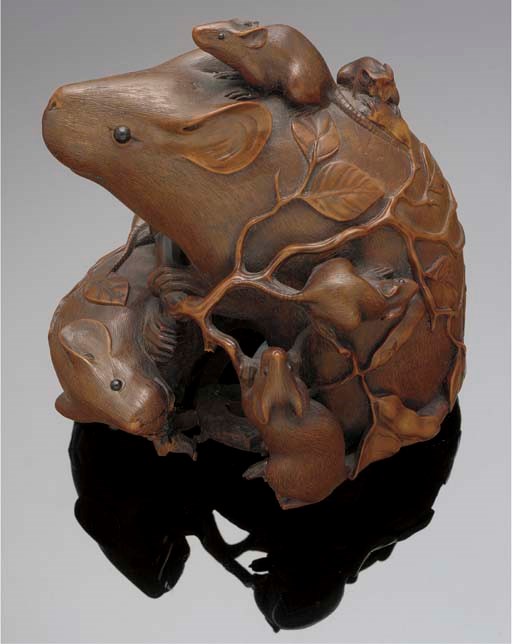 A boxwood okimono of a rat and its young
19th Century