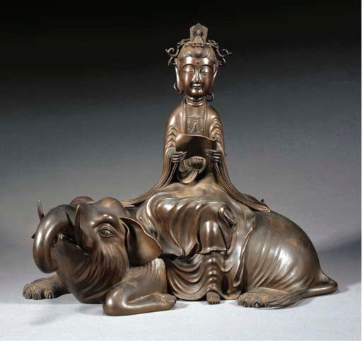A bronze model of Kannon seated upon a recumbent elephant
19th century