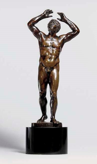 A BRONZE FIGURE OF A MAN