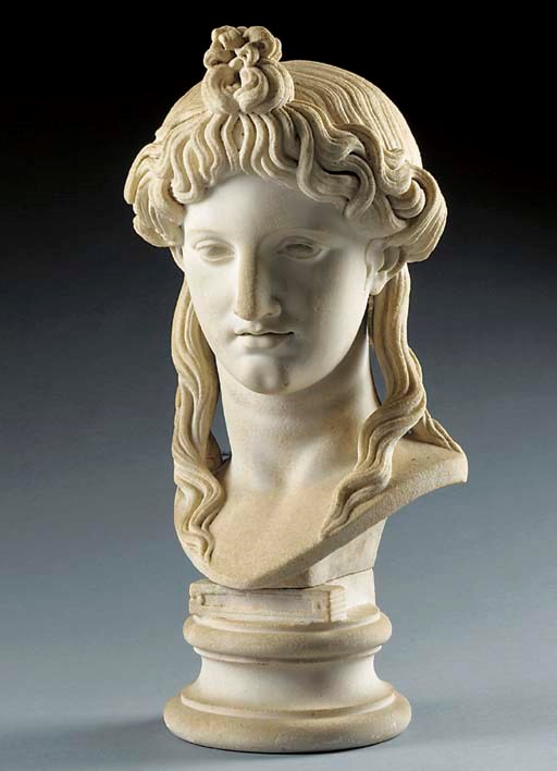 A CARVED MARBLE BUST OF APOLLO