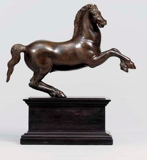 A BRONZE FIGURE OF A REARING HORSE