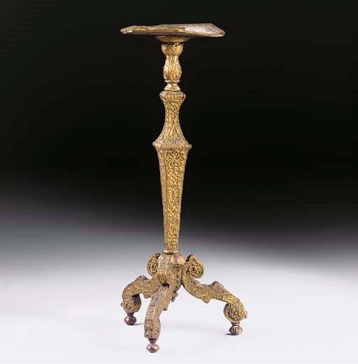 A NORTH EUROPEAN GILT-GESSO TRIPOD TORCHERE