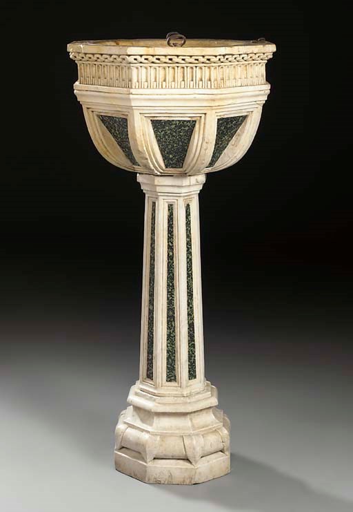 AN OCTAGONAL CARVED MARBLE BAPTISMAL FONT