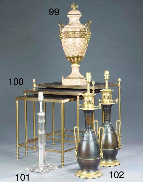 A nest of three brass occasional tables