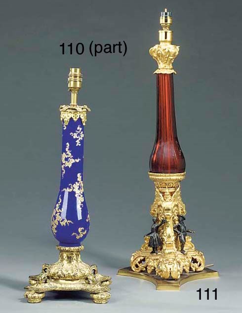 A gilt metal and ruby glass table lamp