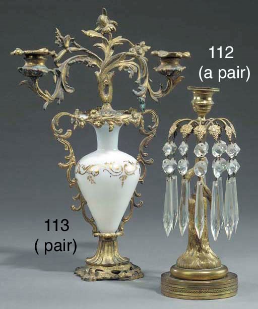 A pair of Regency gilt brass lustre candlesticks