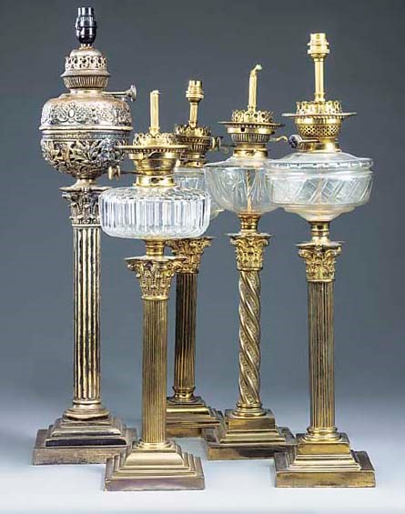 A group of five Late Victorian and Edwardian brass table lamps