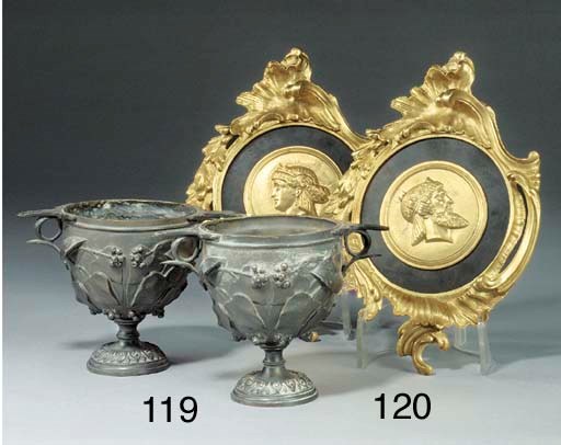 A pair of gilt and patinated metal portrait medallions