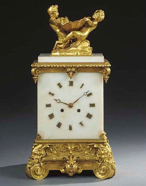 A Napoleon III white marble and gilt bronze mantel clock