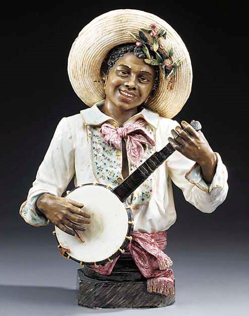 An Austrian glazed terracotta bust modelled as a Negro banjo player