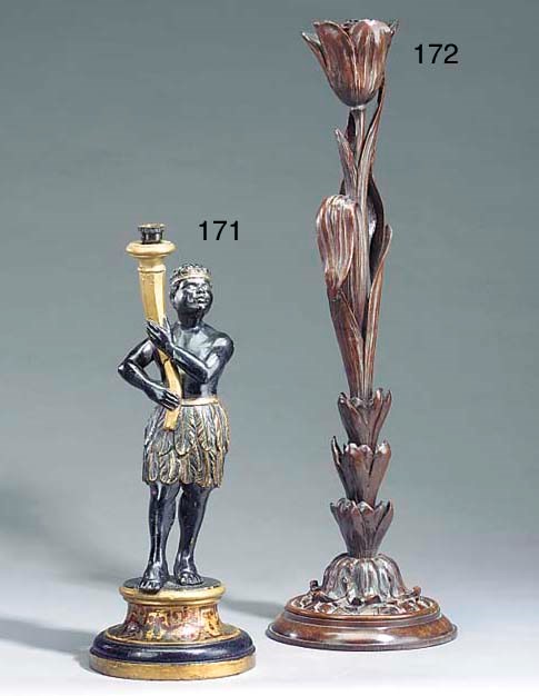 A gilt heightened and polychrome painted carved wood figural table lamp