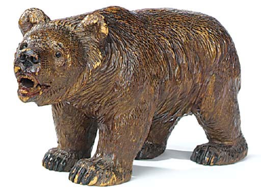 A 'Black Forest' carved and stained wood model of a bear