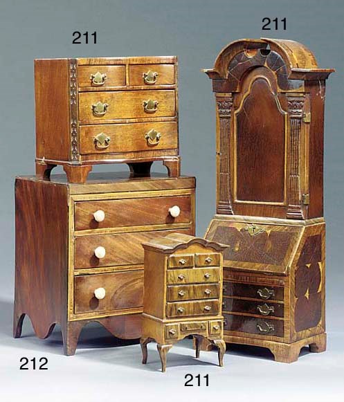 A miniature Regency mahogany veneered three drawer chest