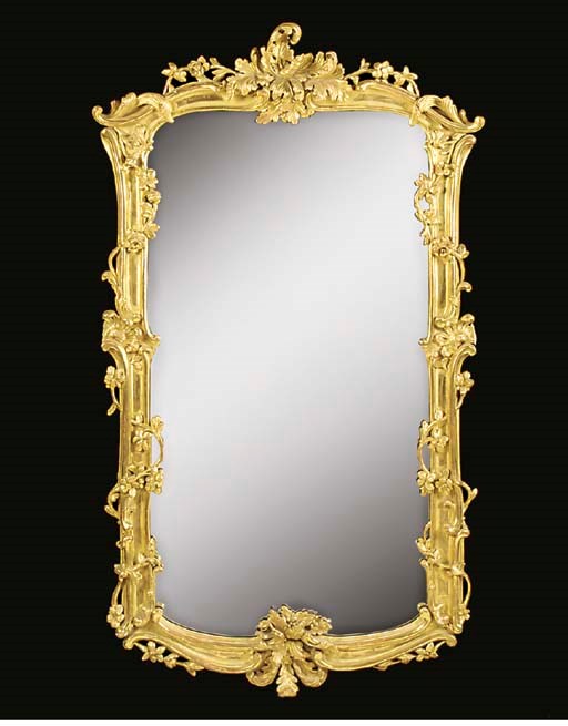 A VICTORIAN ROCOCO GILTWOOD MIRROR