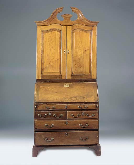 A mahogany bureau cabinet