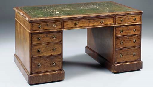 A late Victorian mahogany pedestal desk