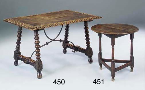 A Spanish carved walnut centre table