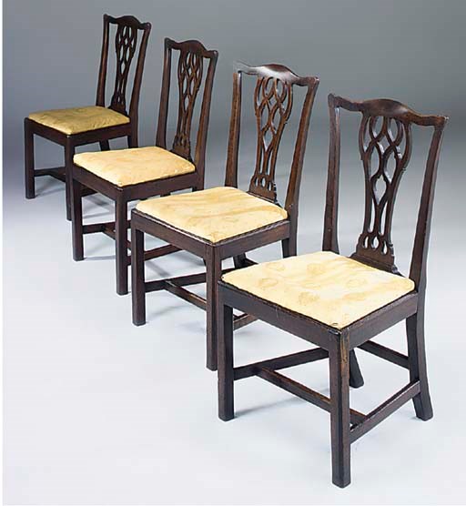 A set of four George III mahogany dining chairs