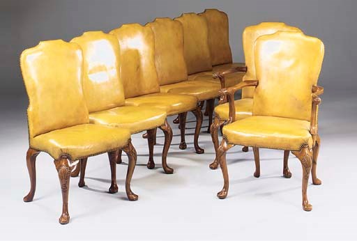 A set of eight walnut dining chairs