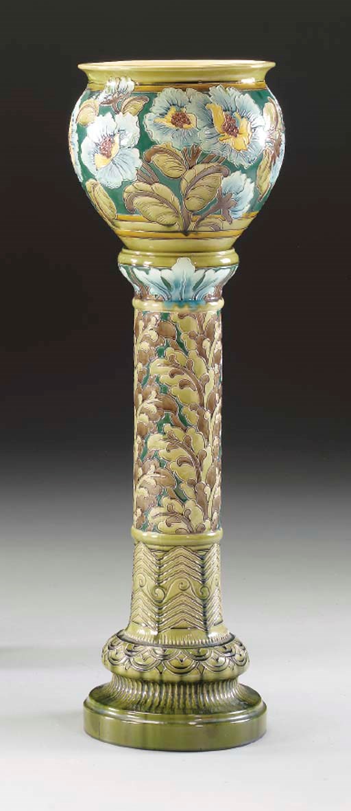 A FAIENCE JARDINIERE AND PEDESTAL