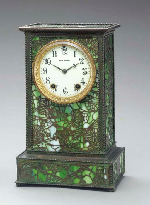 A 'GRAPEVINE' BRONZE AND FAVRILE GLASS MANTEL CLOCK