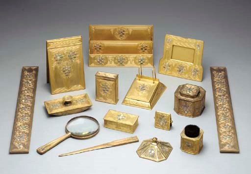 A FIFTEEN-PIECE 'ABALONE' GILT BRONZE DESK SET