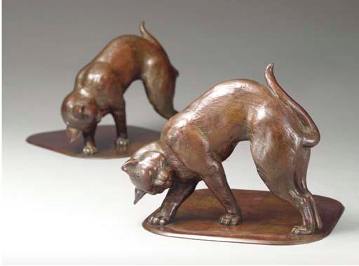 A PAIR OF BRONZE BOOKENDS