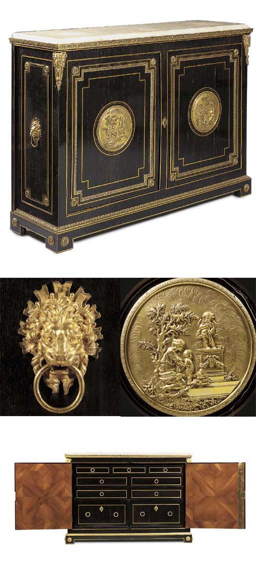 A LATE LOUIS XV ORMOLU-MOUNTED AND BRASS-INLAID EBONY BAS D'ARMOIRE