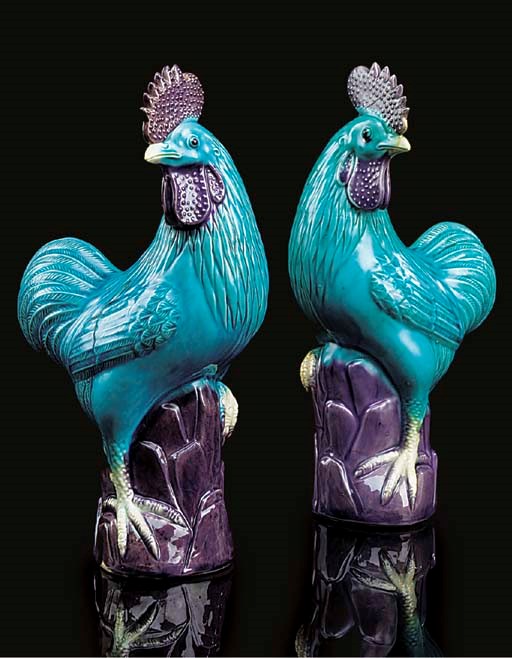 A pair of Chinese turquoise and aubergine-glazed models of cockerels