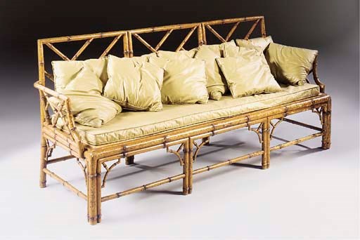 A REGENCY-STYLE POLYCHROME-DECORATED SIMULATED BAMBOO THREE-SEAT SETTEE