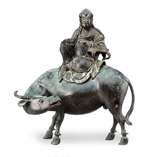 A large Chinese bronze buffalo and Immortal group
