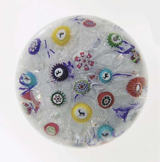 A Baccarat signed and dated scattered millefiori weight