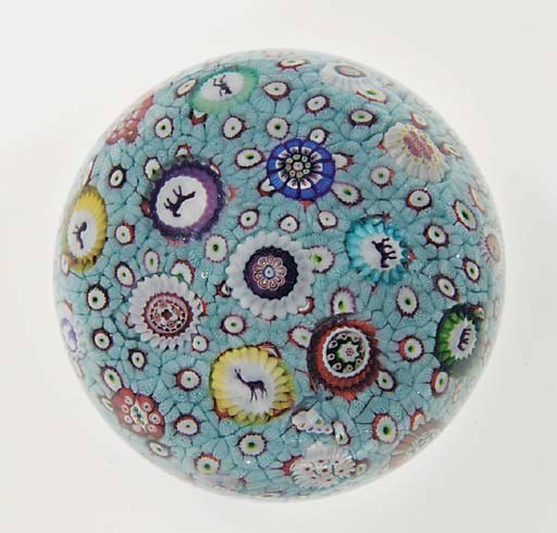 A Baccarat signed and dated carpet-ground scattered millefiori weight
