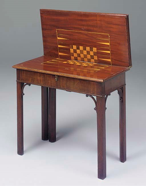 A GEORGE III MAHOGANY AND INLAID TRIPLE FOLDING TOP GAMES TABLE