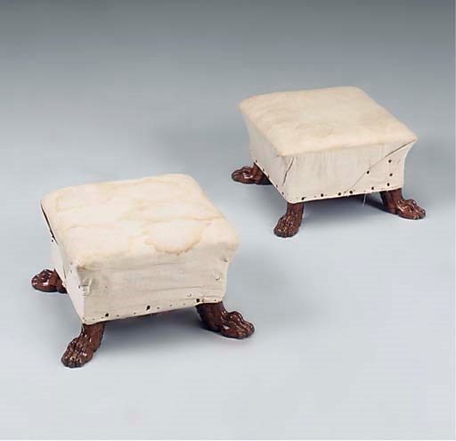 A PAIR OF WALNUT FOOTSTOOLS