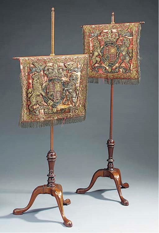 A pair of Victorian mahogany and tapestry-work adjustable pole screens