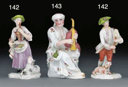 A pair of German porcelain figures of a shepherd and shepherdess