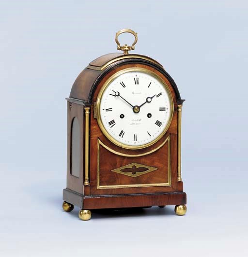 A Regency parcel-ebonised mahogany and brass-mounted small striking bracket clock