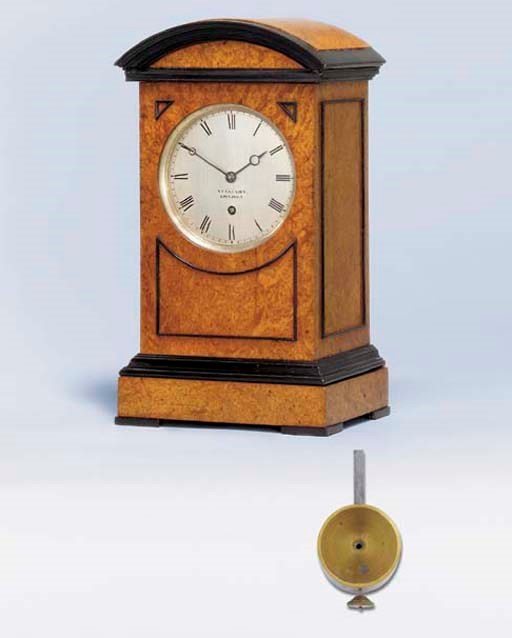 A William IV burr-walnut and ebonised library timepiece